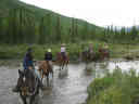 horseback riding across river